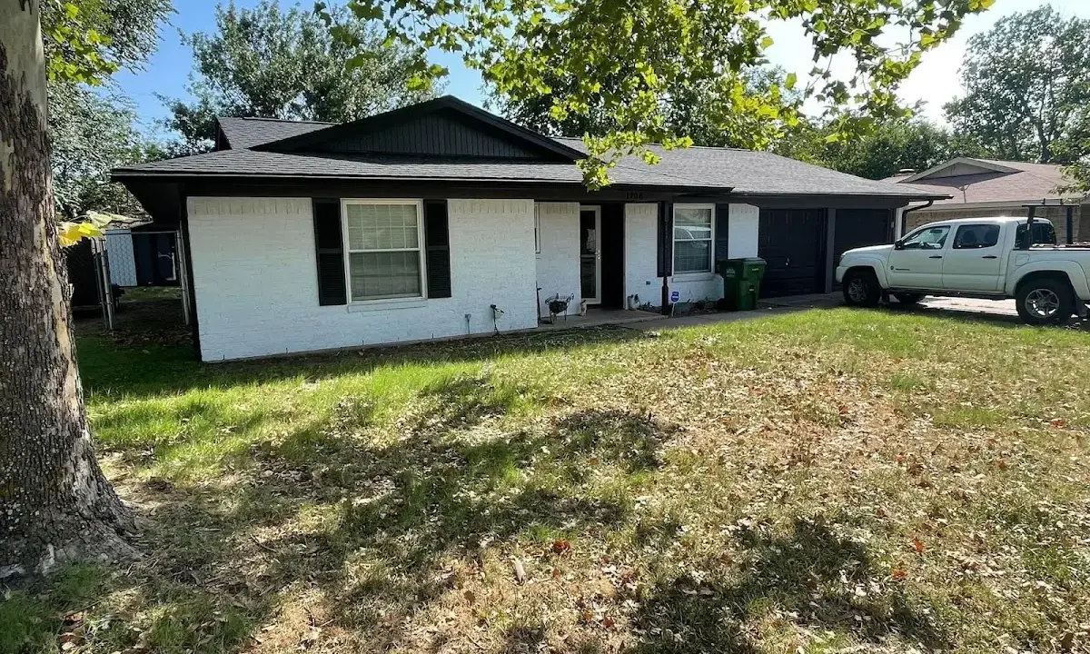 Professional roofing crew working on a residential roof in Sterling Heights